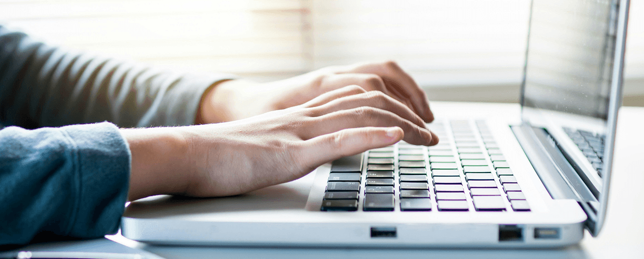 Hands Typing On Computer
